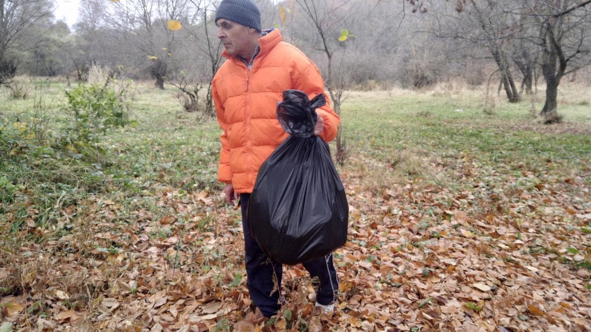 Volunteer with a garbage bag.jpg